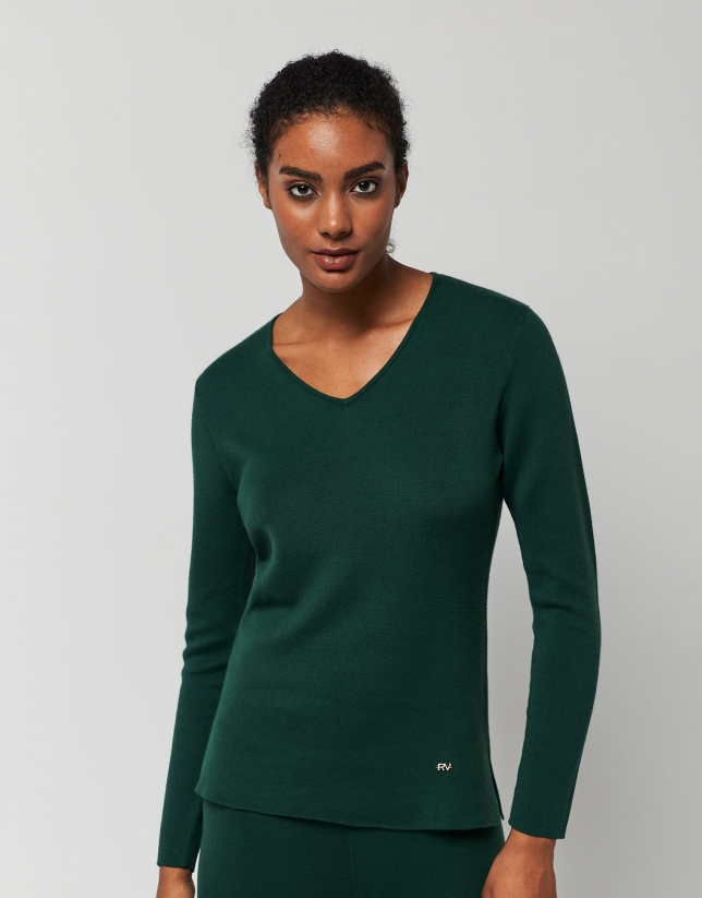 Green knit sweater with openings
