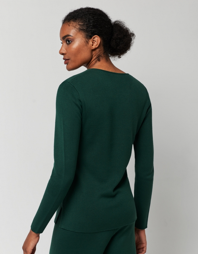 Green knit sweater with openings