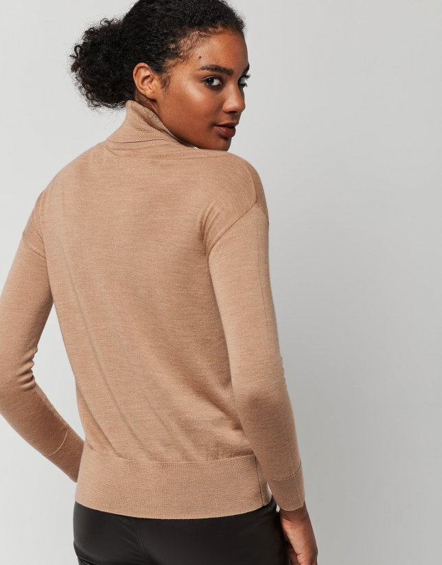 Beige fine knit sweater with turtleneck.