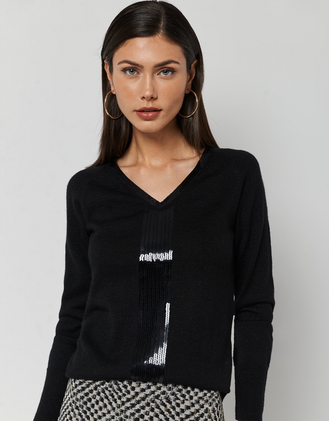 Black fine knit sweater with rhinestones in the front