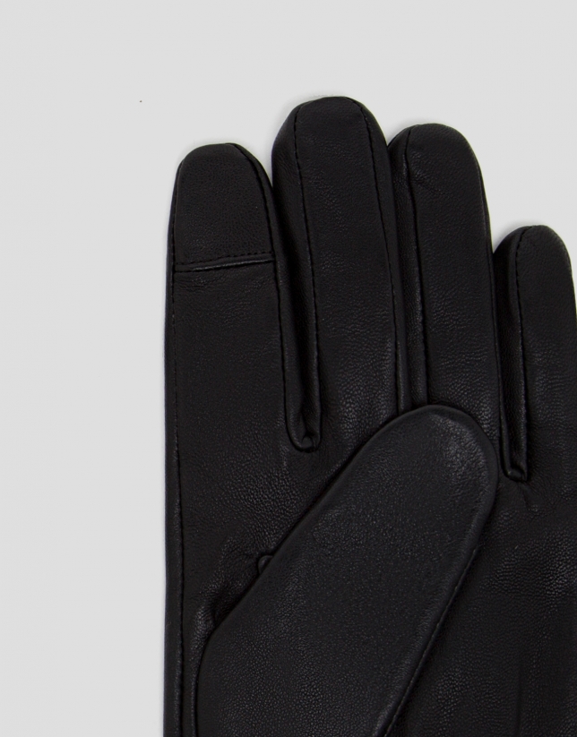 Black leather gloves with stitching design on the top