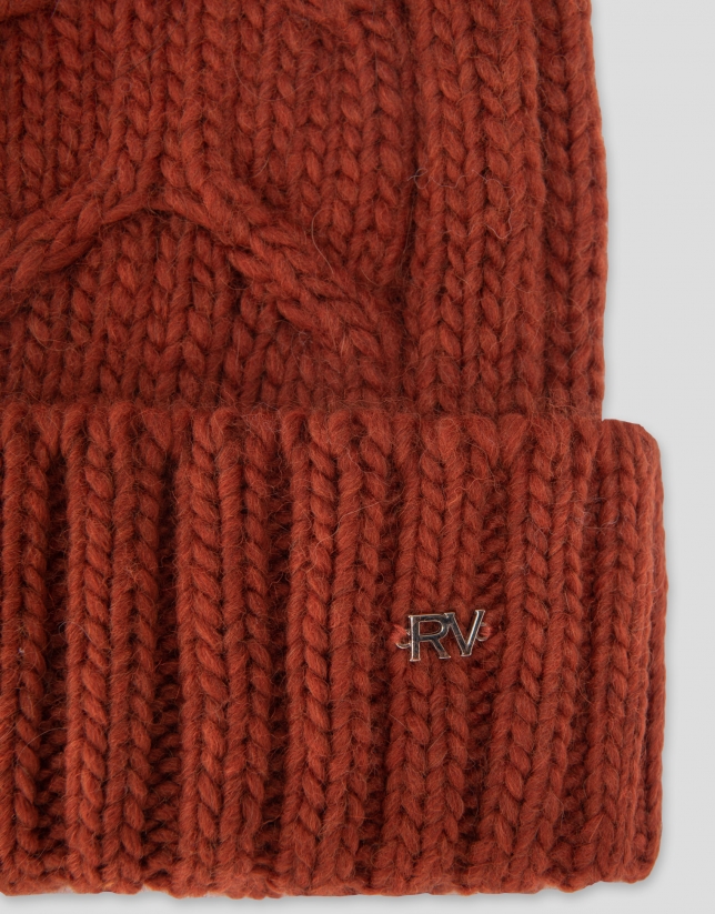 Brick red knit cap with herringbone design and ribbing