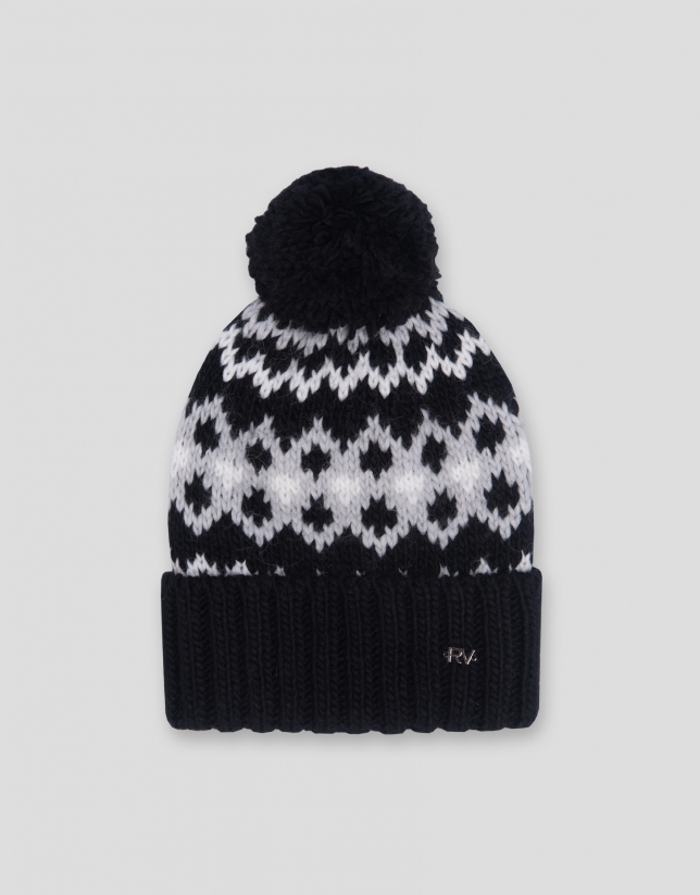 Black and white knit cap with alpine design and ribbing