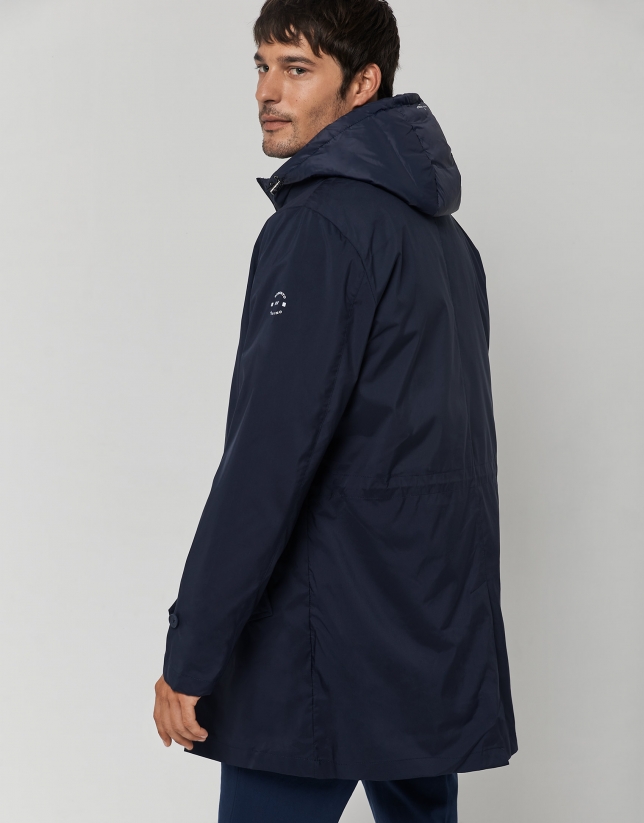 Navy blue tech fabric raincoat with blue quilted vest