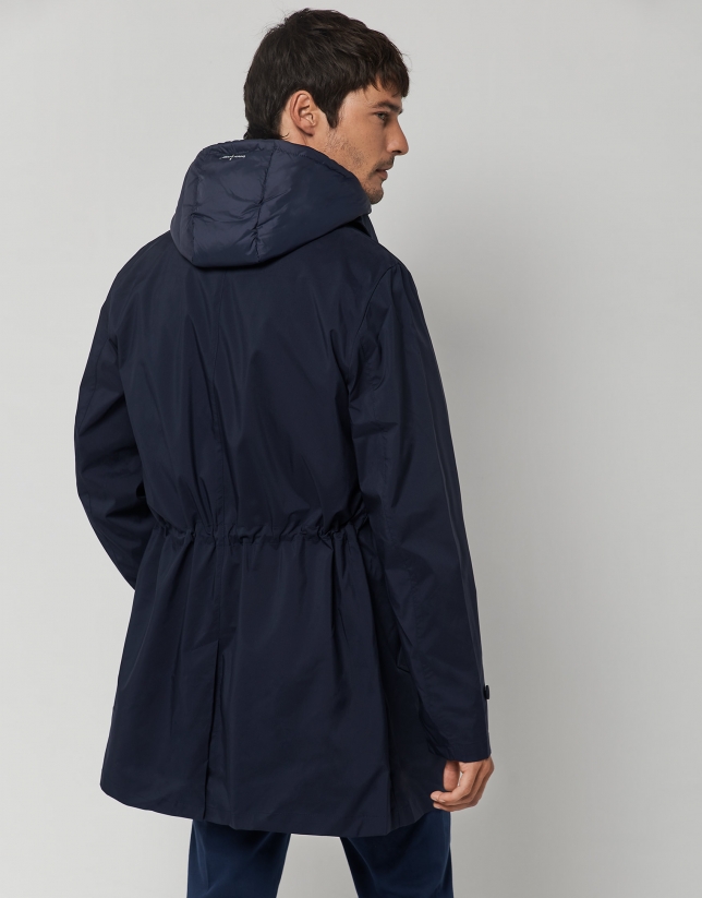 Navy blue tech fabric raincoat with blue quilted vest