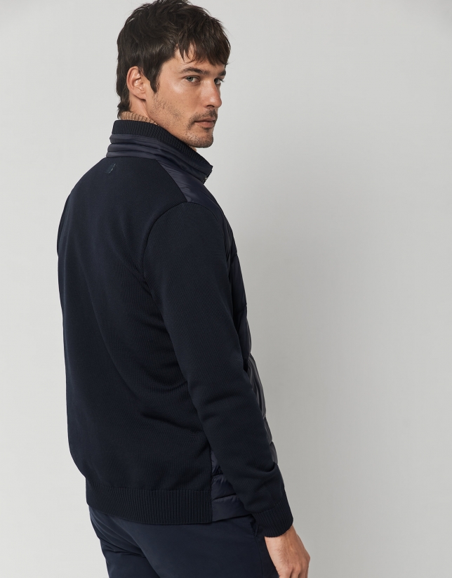 Navy blue quilted windbreaker with knit sleeves