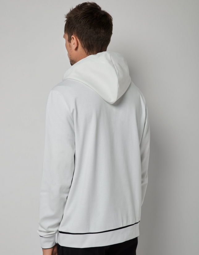 White felt sweatshirt with a design on the chest 