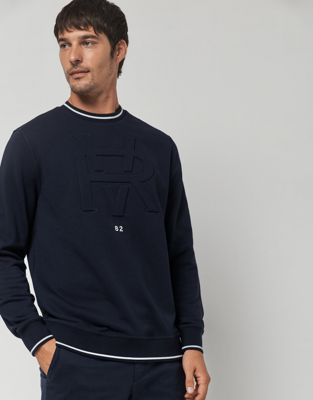 Navy blue felt sweatshirt with embossed RV logo on the chest