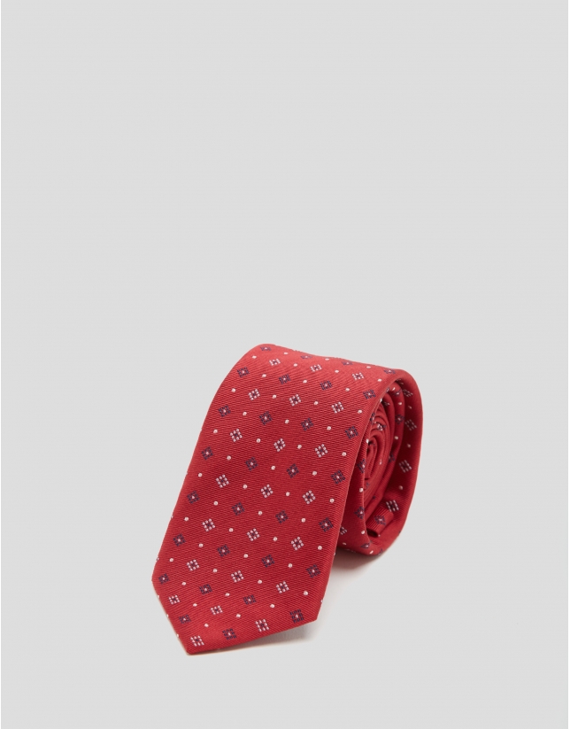 Red silk tie with a beige and navy blue floral print jacquard