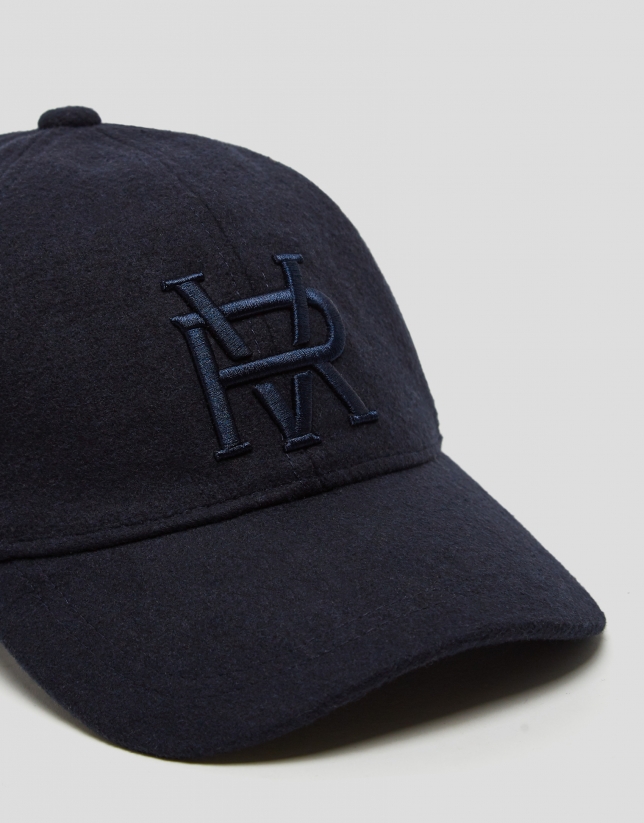 Navy blue felt baseball cap with embroidered design