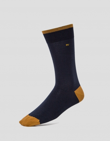 Two pairs of socks, one with a navy blue and yellow design and the other with navy blue and green stripes