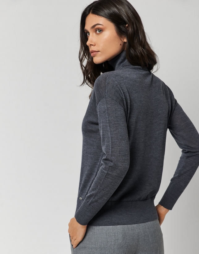 Dark grey fine knit sweater with turtleneck.