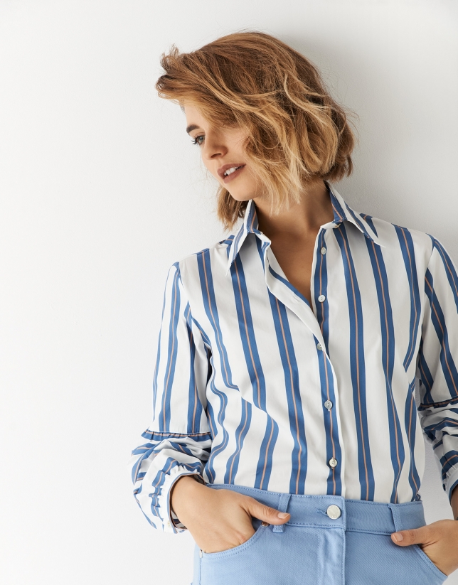 White cotton blouse with puffed sleeves and blue and orange stripes