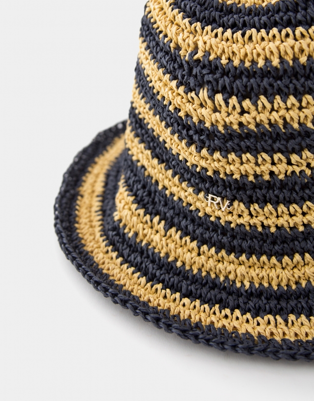 Navy blue and beige crocheted fisherman-style cap