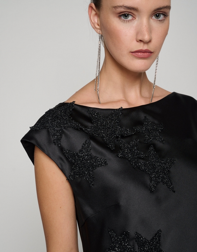 Black satin midi dress with embroidered stars