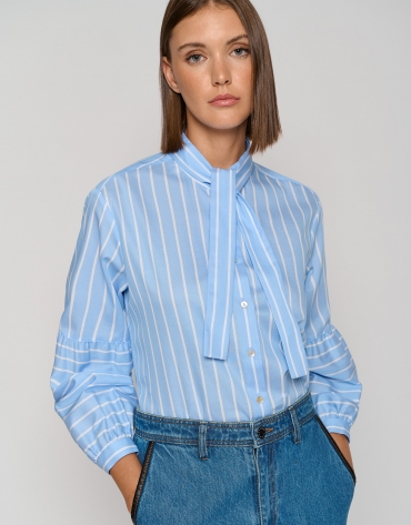 Blue striped blouse with puffed sleeves and a bow