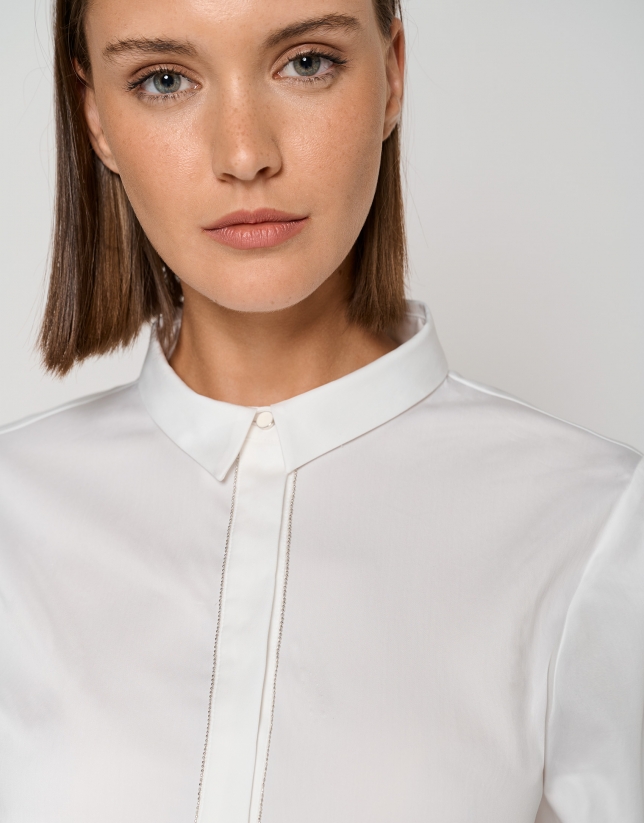 White blouse with glitter on flap