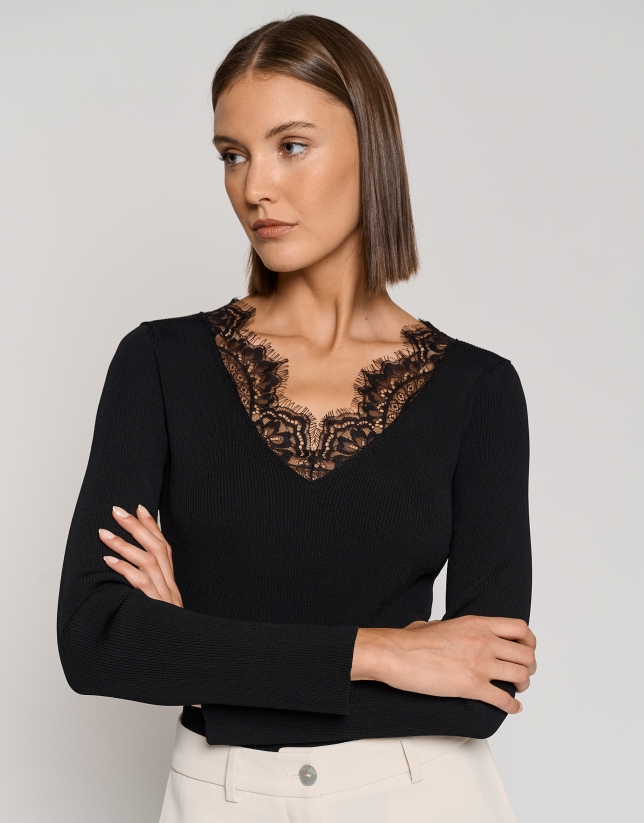 Black ribbed sweater with lace and V-neck