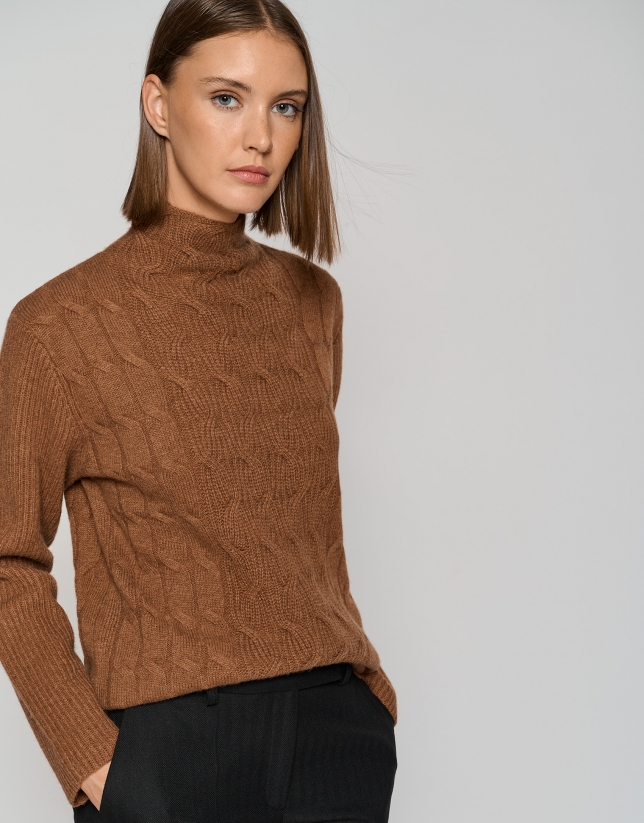 Brown sweater with cable stitching and ribbing