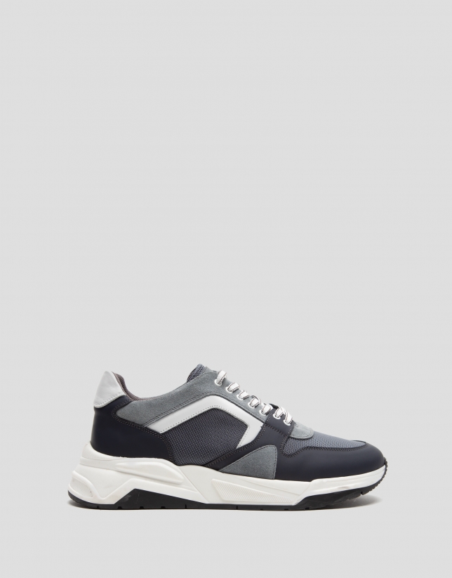 Gray running shoes with track sole