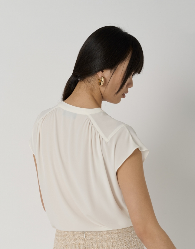 Ecru blouse with gathered yoke on shoulders