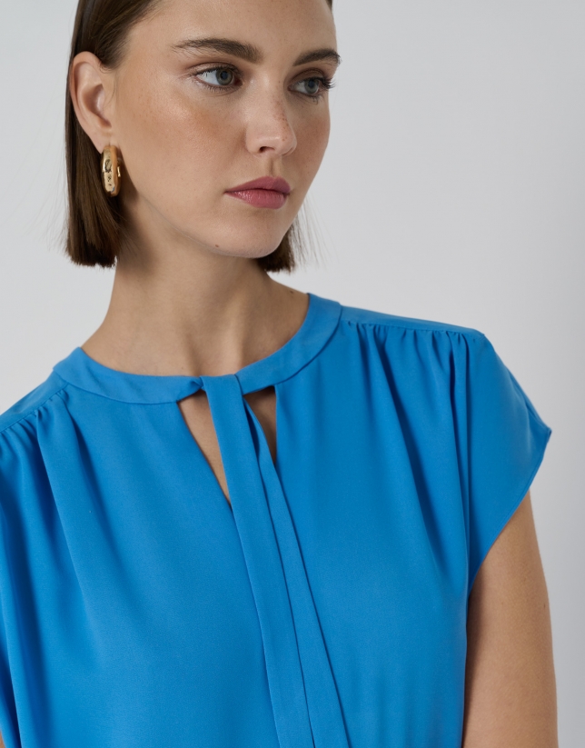 Blue blouse with gathered yoke on shoulders