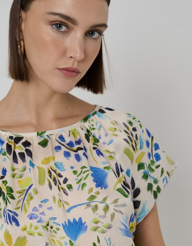 Cheesecloth blouse with round, puckered neckline and blue floral print