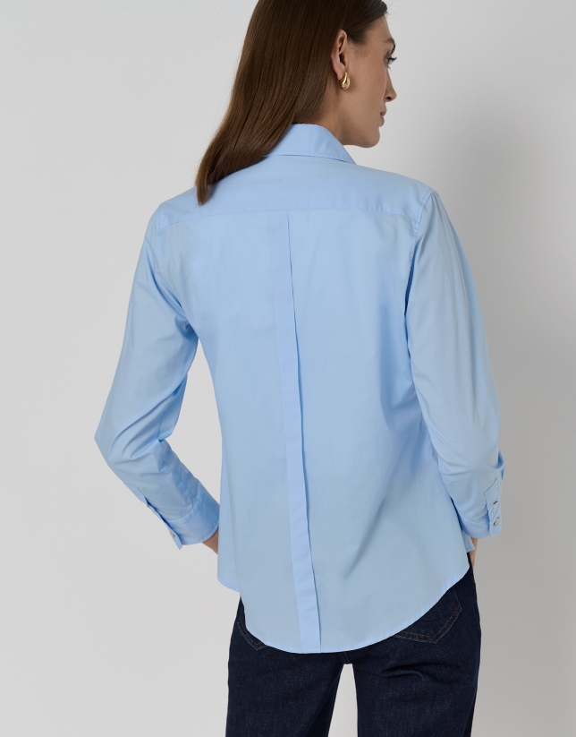 Blue men's shirt with logo on chest