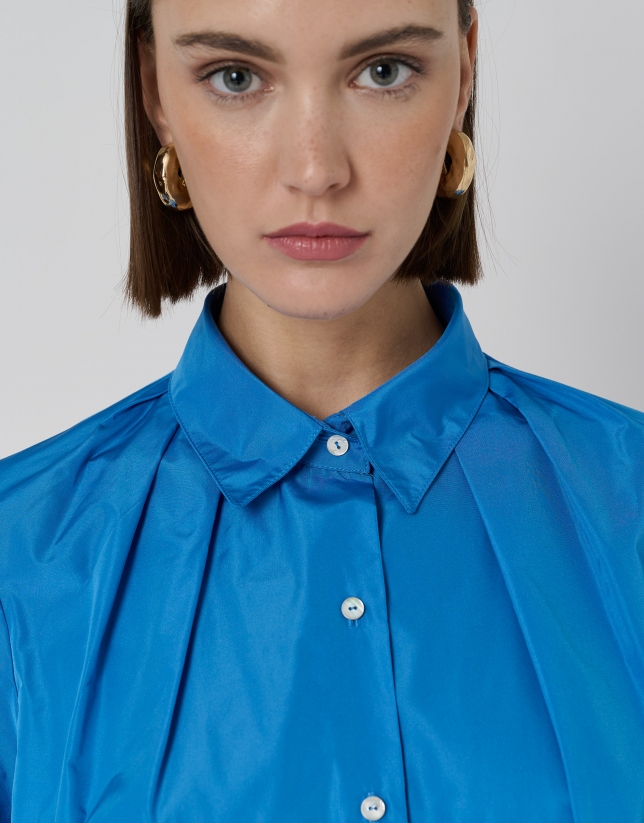 Blue taffeta oversize blouse with sleeves and tie bow