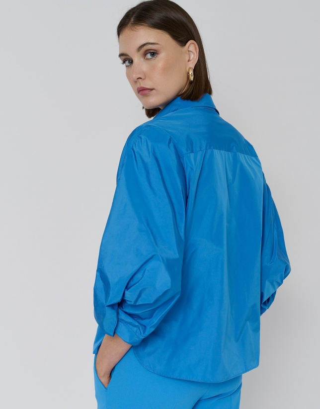 Blue taffeta oversize blouse with sleeves and tie bow