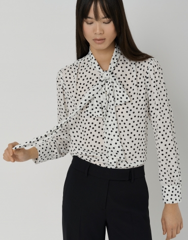 Blouse with bow and black and white dotted print