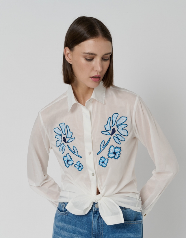 White shirt with embroidered blue flowers