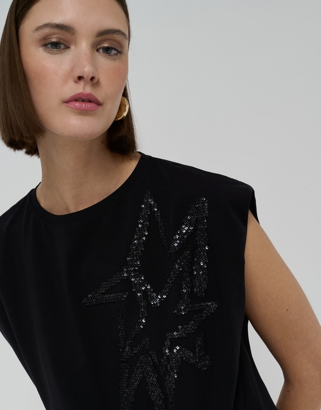 Black top with embroidered stars and tie