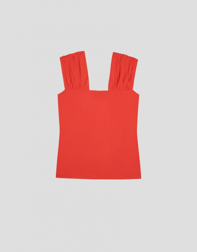 Red knit top with puckered shoulders