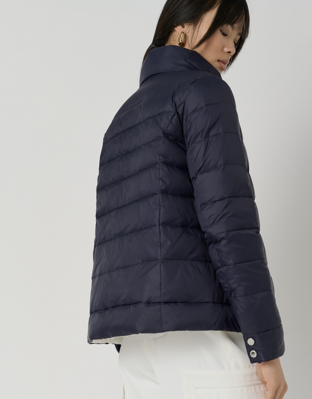 Navy blue and white reversible quilted windbreaker