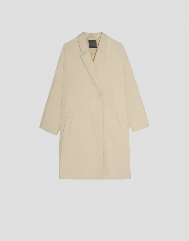 Cream colored oversize raincoat