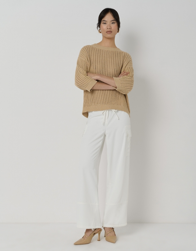 Cream-colored knit sweater with ribbing