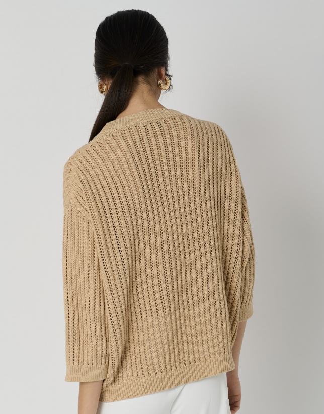 Cream-colored knit sweater with ribbing