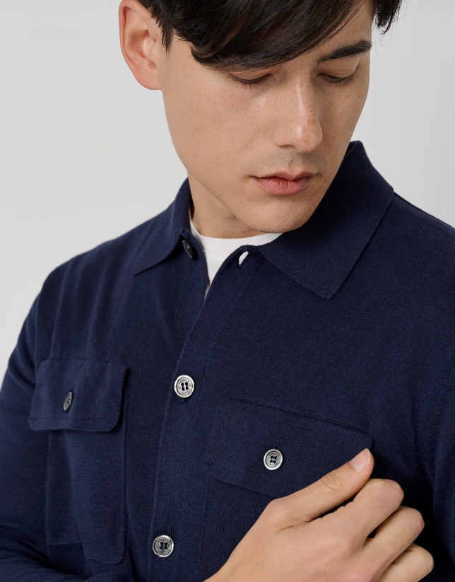 Navy blue jacket with chest pockets and buttons