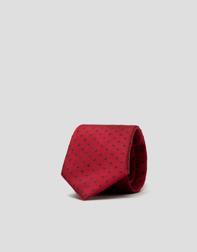 Red silk tie with navy blue polka dots