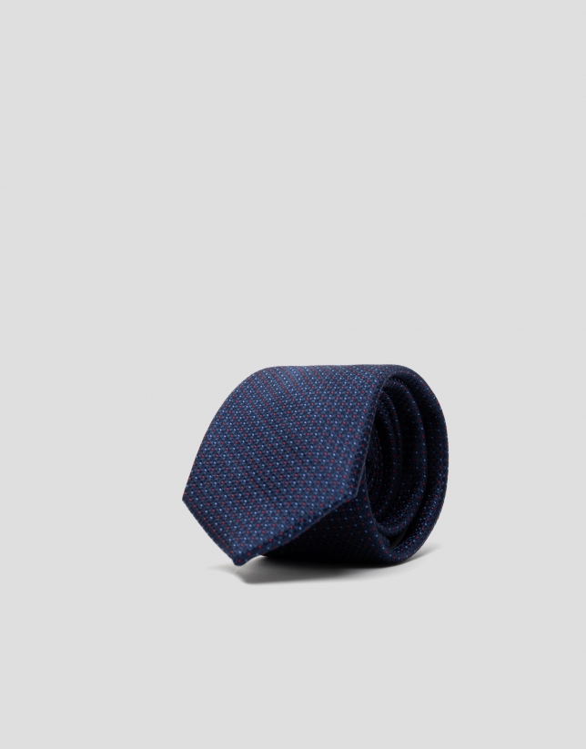 Ink blue silk tie with red and blue dots