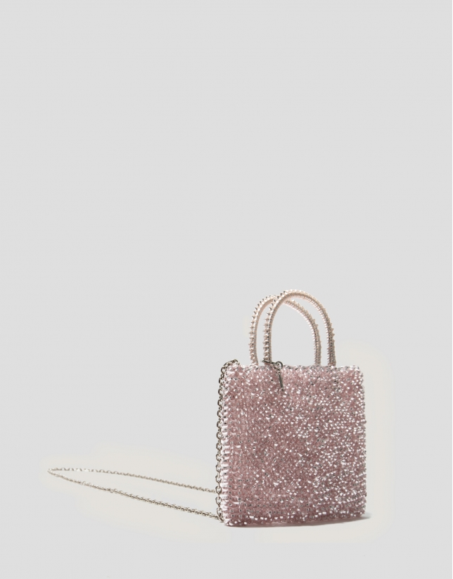 Light pink hand- braided Devyn Flat handbag