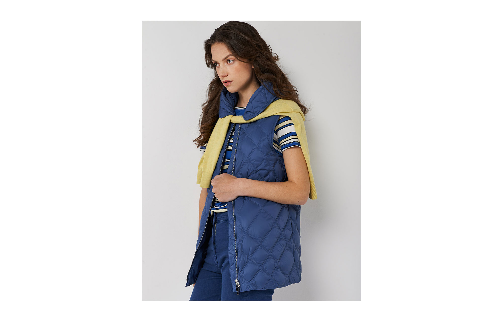 Long blue quilted vest